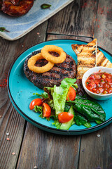 Steaks with seasoning and herbs