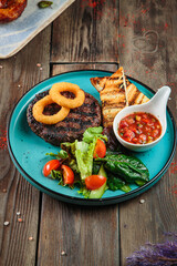 Steaks with seasoning and herbs