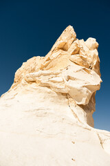 White rock formations and sand dunes in Egypt's White Desert, natural desert landscape	