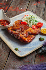 Steaks with seasoning and herbs