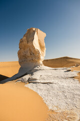 White rock formations and sand dunes in Egypt's White Desert, natural desert landscape	
