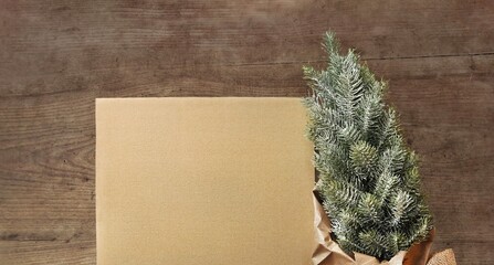 Christmas card without text. Blank cardboard sheet, artificial Christmas tree, paper decorations....