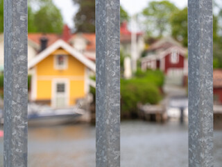 Colorful Waterfront Houses Framed by Metal Railings