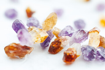Raw Citrine and Amethyst Crystal Points on Marble Background

