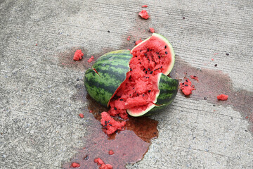 Close-up of a broken watermelon on the ground