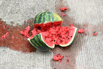 Close-up of a broken watermelon on the ground