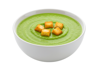 A bowl of green soup with croutons set against a black background