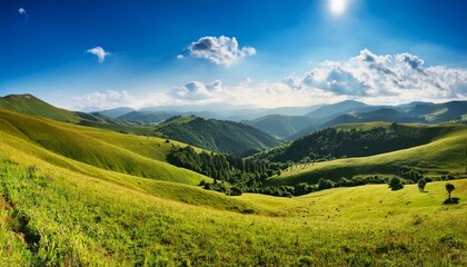 Naklejka premium panoramic view of a summer day in the mountains green meadows mountain slopes and hills countryside