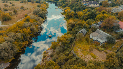 aerial landscape fall river stream nature rural scenic view with orange foliage of September time and living rustic cottage house object