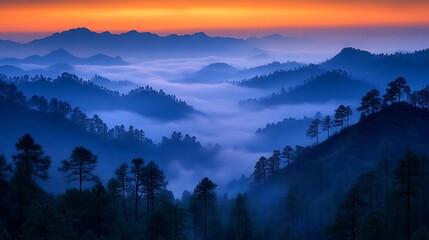 Fototapeta premium Misty mountain range at sunrise.