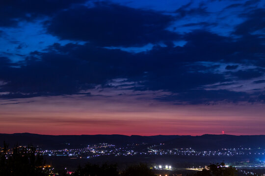 Dusk orange and blue sky and ccity lights