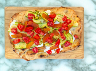 Roman-style flatbread with zucchini, cherry tomatoes and bottarga
