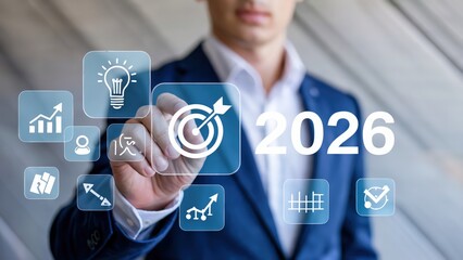 Man points to target icon with 2026 for business goals and future vision