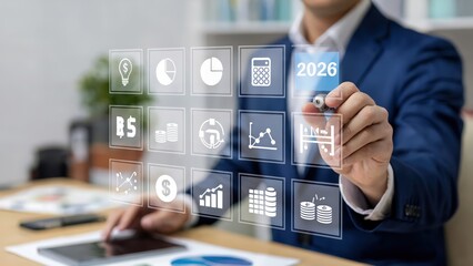 Businessman pointing to 2026 on a futuristic touchscreen display
