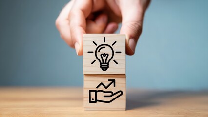 Business growth concept with lightbulb icon and hand holding arrow pointing up