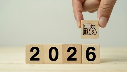 Future financial planning and money concept with 2026 on wooden blocks