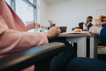 Business colleagues actively engaged in group work at a vibrant office, highlighting interaction...
