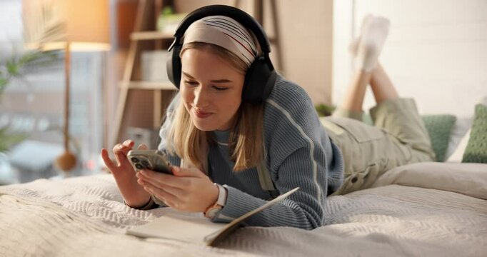 Woman, phone and happy with headphones, bed and listen to music on web, chat and relax in home. Girl, smartphone and smile with click on mobile app. streaming or social media in bedroom at apartment