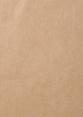 Fototapeta premium Wrinkled brown kraft paper texture with fold lines for vintage packaging design, organic product branding, scrapbooking backgrounds, or recycled material artwork and rustic aesthetics