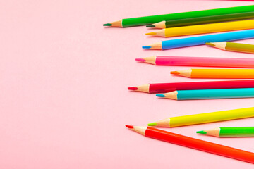 Colored pencils on a bright colored background. Equipment for coloring. Stationery for creativity.Back to school. Flatlay. Children's Creativity and Education. Rainbow.Space for text. Copy space.