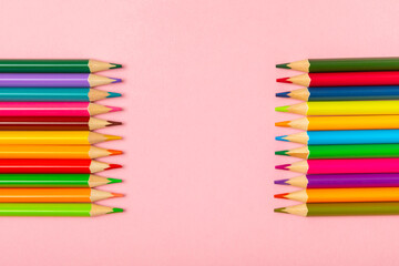 Colored pencils on a bright colored background. Equipment for coloring. Stationery for creativity.Back to school. Flatlay. Children's Creativity and Education. Rainbow.Space for text. Copy space.