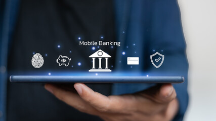 Hand holding tablet with mobile banking icon, digital payment, online financial transaction, and...