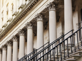 Stone colonnade and stairs detail. Classical pillars row in a building facade