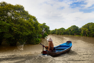 Tonle Sap lake, Siem reap Province, Cambodia. Fisherman in his boat, Floating village of Kompong...