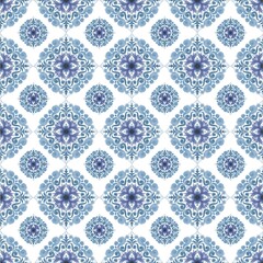 A beautiful seamless pattern featuring intricate blue and purple floral mandala motifs, rendered in a soft watercolor style. This elegant and symmetrical design creates a repeating tile