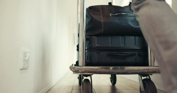 Luggage, help and trolley with person in hotel for bellhop assistance, guest escort and welcome service. Suitcase, concierge and bag porter with legs of employee for hospitality, checkout and walking