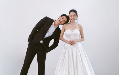 Portrait of Asian elegant bride groom smiling nice lovely looking at camera head on shoulder...