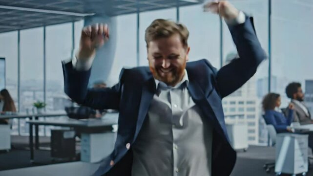 happy emotional businessman dancing with joy in modern office