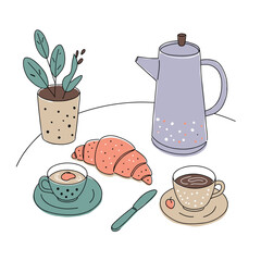French breakfast setup with croissant, coffee, and a teapot on a table
