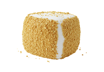 A square cake features a vertical white stripe coated in tan crumbles against a black background with scattered crumbs