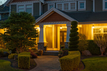 Entrance of luxury house with nice spring blossom landscape at night in Vancouver, Canada, North...