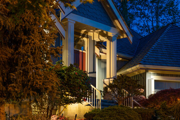 Entrance of luxury house with nice spring blossom landscape at night in Vancouver, Canada, North...