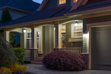 Entrance of luxury house with nice spring blossom landscape at night in Vancouver, Canada, North...