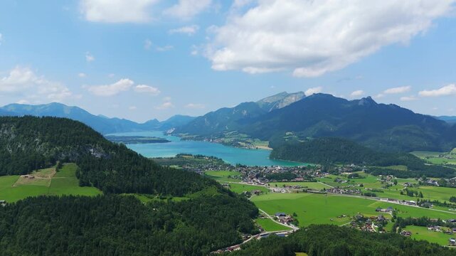 Birds eye view of Strobl town with Lake Wolfgang and the surrounding Alps.