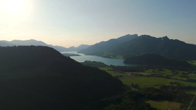 Panoramic aerial view of the municipality of Strobl with Lake Wolfgang and the Salzburg Alps.