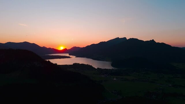 Soft sunset glow over Lake Wolfgangsee and Strobl Town captured in vibrant evening atmosphere