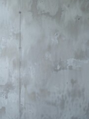 A simple gray wall with a vertical line running along the left side of the frame and some imperfections