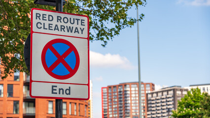 Red Route Clearway End traffic sign on roadside in London