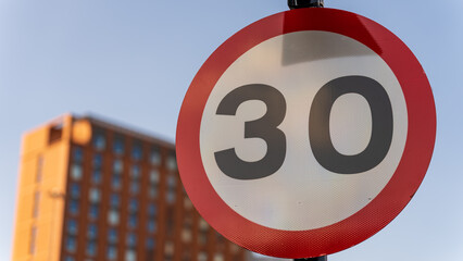 30 miles per hour road speed limit sign in urban area