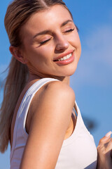  portrait of a woman wearing natural sun-kissed makeup, captured in strong sunlight. glowing skin,...