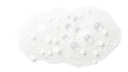 Pile of white powder with water droplets and solid spheres creating a textured pattern on a clean background