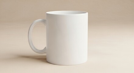 Fototapeta premium A plain white ceramic mug sits on a neutral background, ready for customization or design.