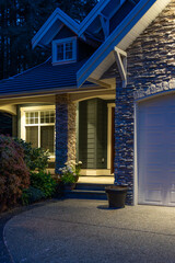 Entrance of luxury house with nice spring blossom landscape at night in Vancouver, Canada, North...
