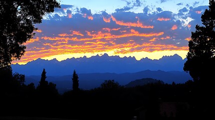 Dramatic sunset over a mountain range.