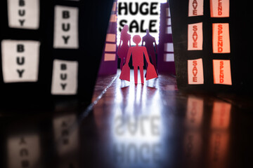 Conceptual image of a man with shopping bags walking with other shoppers toward a bright SALE sign...