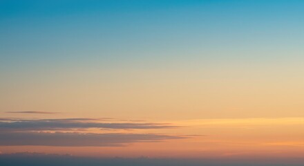 Vibrant sunset sky with blue-orange gradient, minimal clouds below, clean background, high resolution, peaceful mood.
